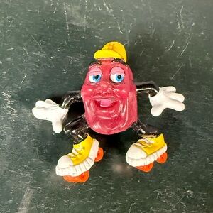 Vintage California Grapevine Raisin Roller Skater Figurine. Retired 1988